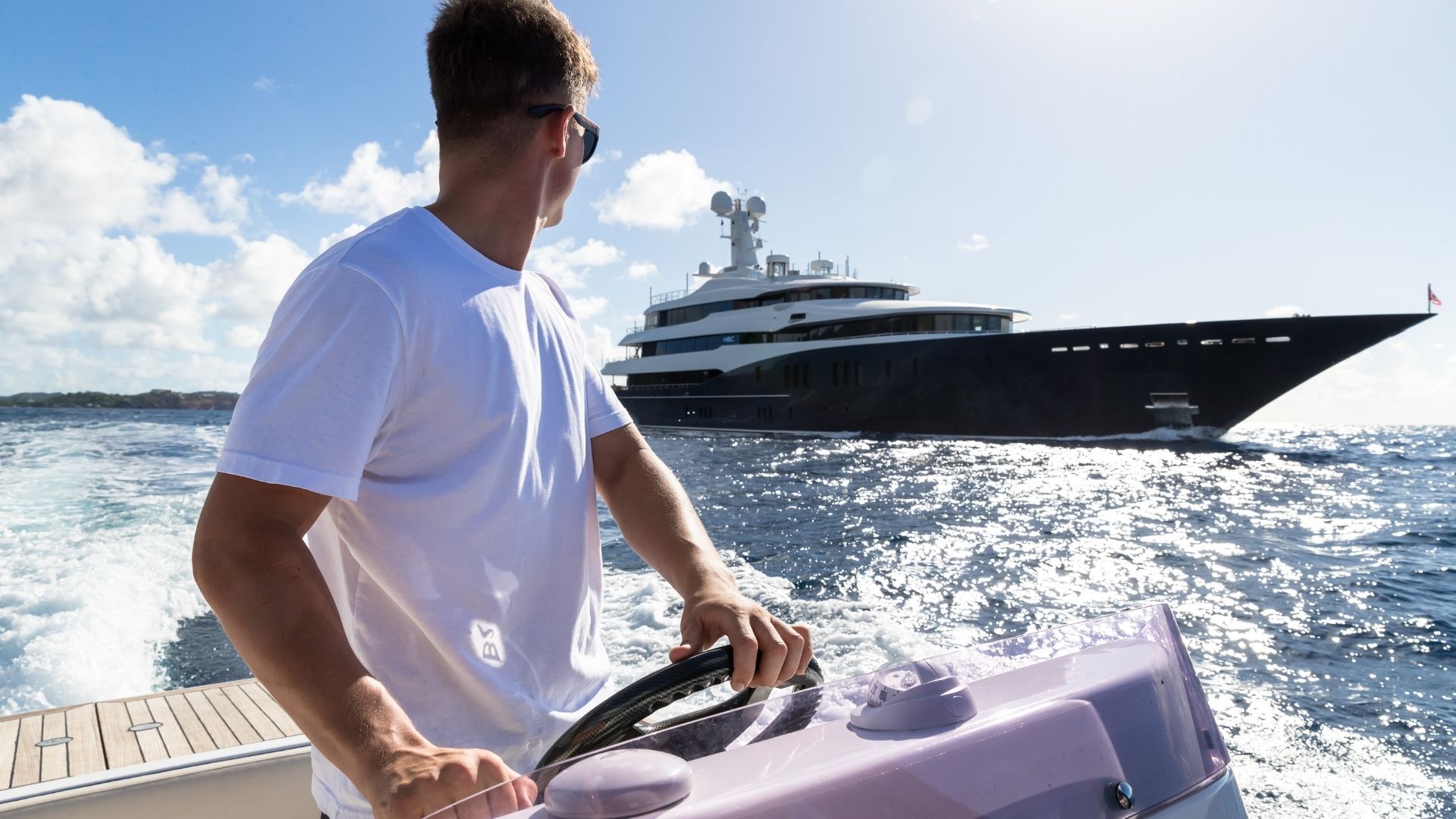 an iyc yacht crew member on the chase boat of the yacht hbc