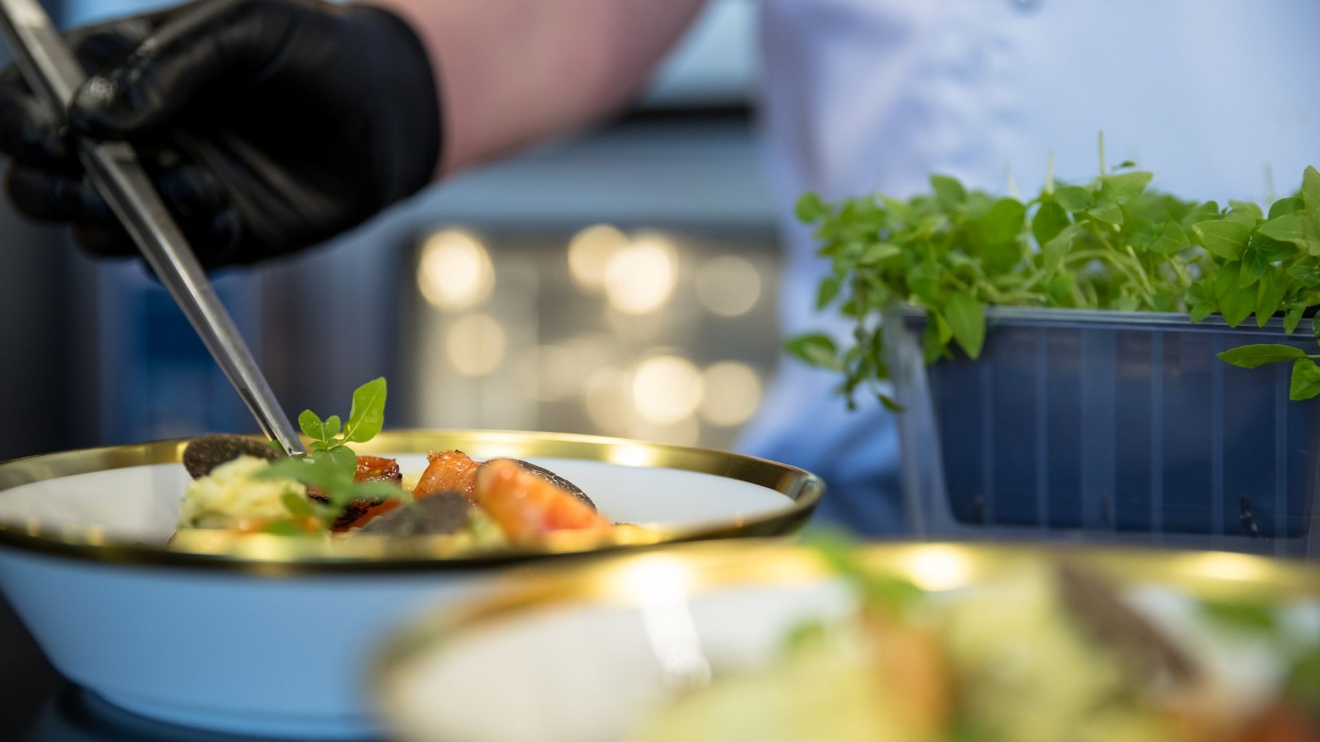close up on the hands of the chef of the iyc yacht hbc preparing a meal