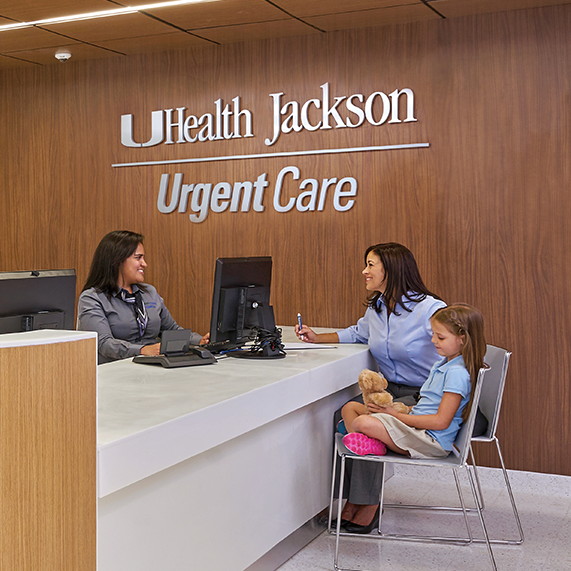 Mom and daughter being attended to by UHealth Jackson Urgent Care staff