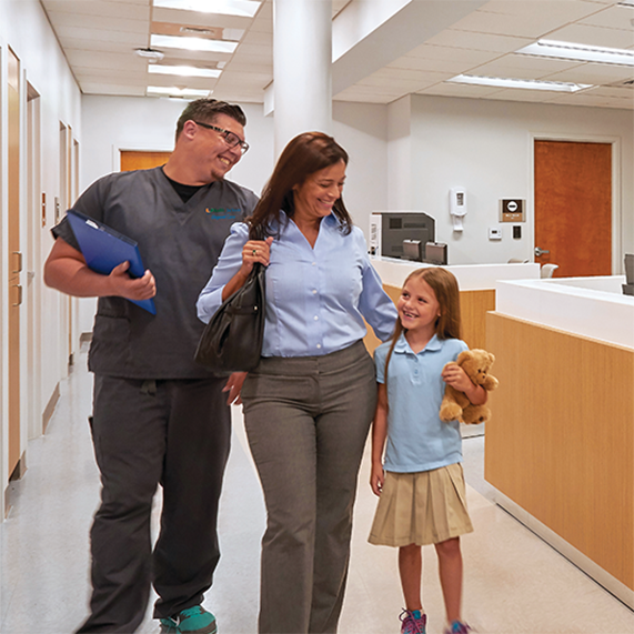 Mom and daughter being attended to by a UHealth Jackson Urgent Care nurse