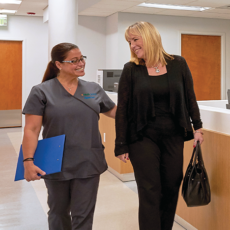 Patient with nurse at UHealth Jackson Urgent Care