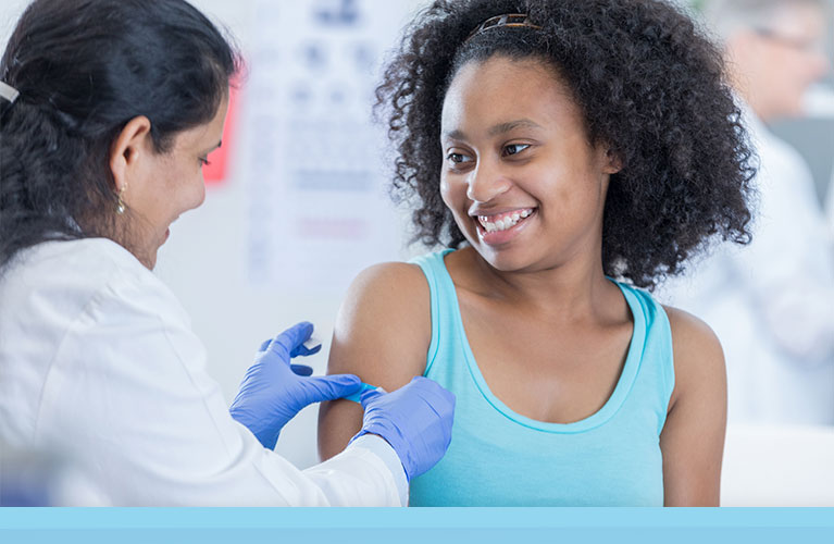 Young woman getting a flu shot