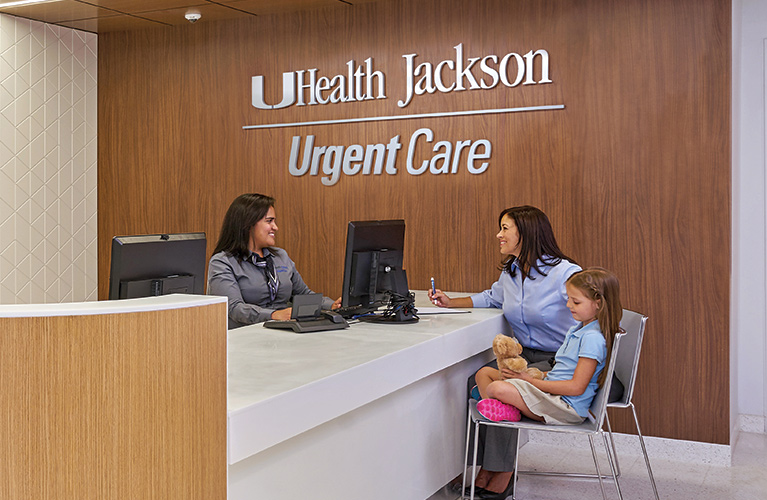 Mom and daughter being attended to by UHealth Jackson Urgent Care staff