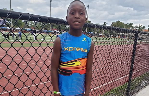 boy in running uniform