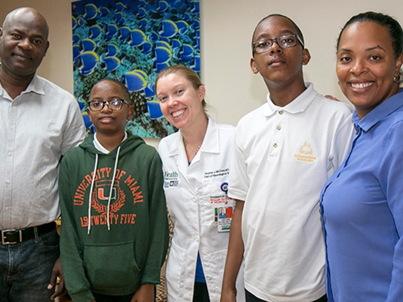 David Dorval and Family with Heather J. McCrea, MD, PhD, a UHealth - University of Miami Health System pediatric neurosurgeon at Holtz Children’s Hospital
