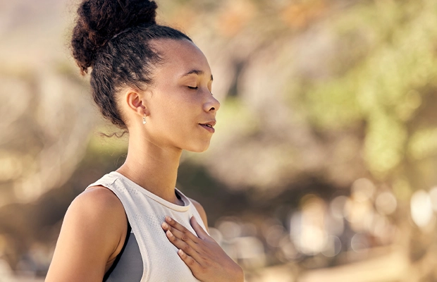 closeup of woman breathing deep
