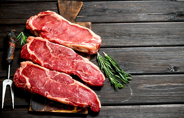 raw meat served on a black tray