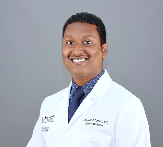 Close-up of a man wearing a doctor's coat.