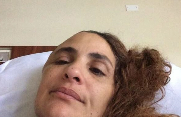 Close-up of a woman lying on a hospital stretcher