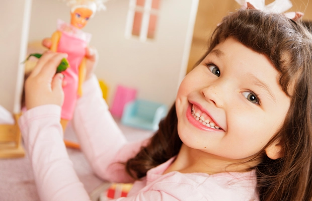 Girl playing with a Barbie