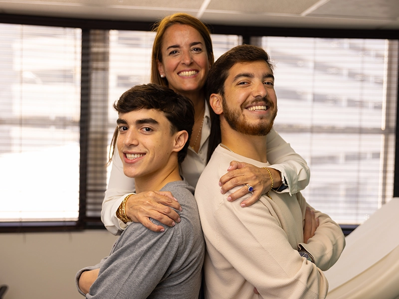 Photograph of a mother with her two adult children