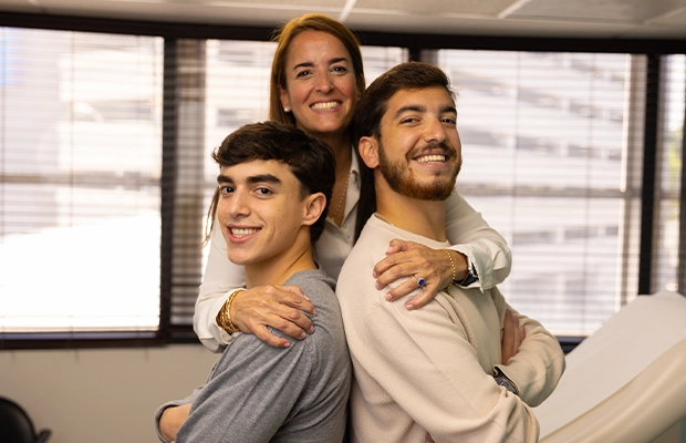 Photograph of a mother with her two adult children