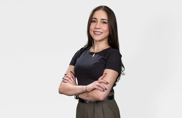 Medium shot of a woman posing for the camera against a white background