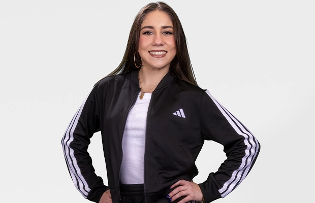 Medium shot of a woman posing for the camera against a white background
