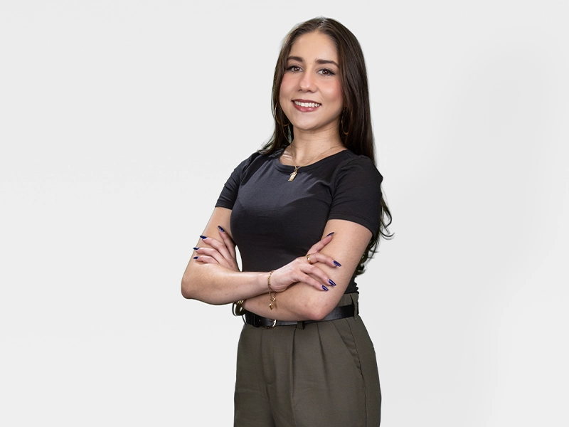 Medium shot of a woman posing for the camera against a white background