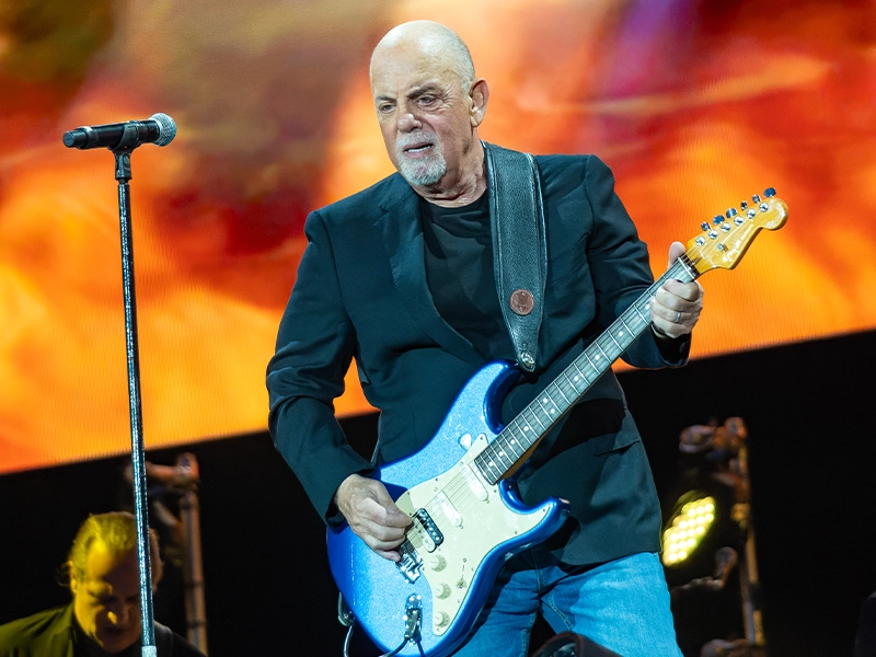 Billy Joel playing the guittar