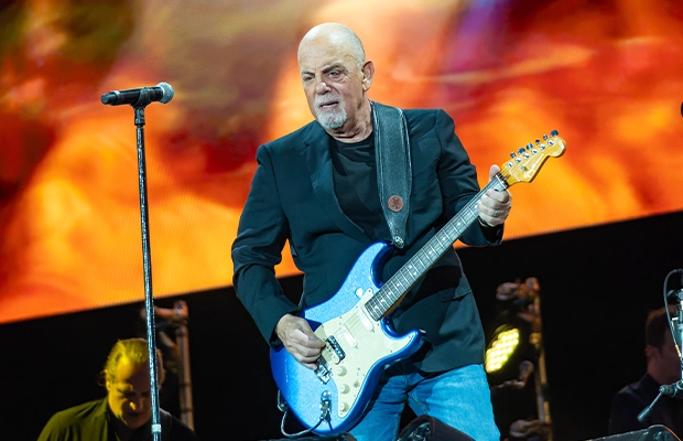 Billy Joel playing the guittar