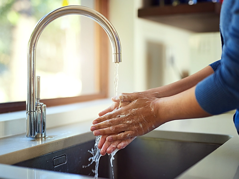 a person washing their hands