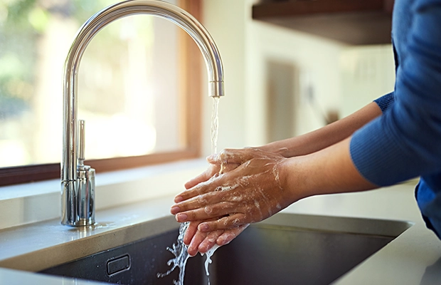 a person washing their hands