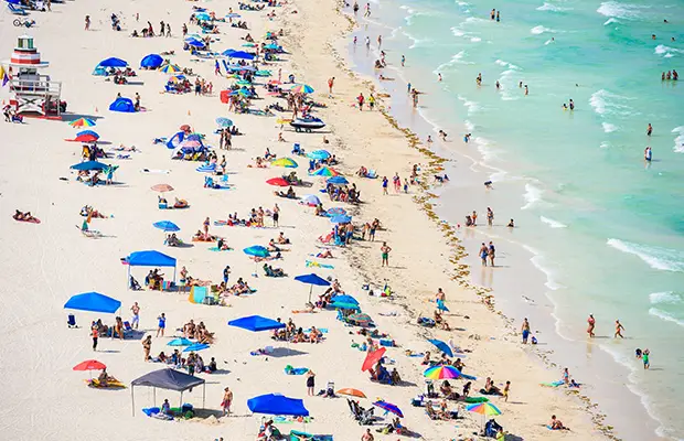 A birds eye view of a crowd of people at the beach