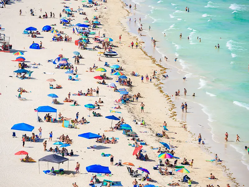 A birds eye view of a crowd of people at the beach