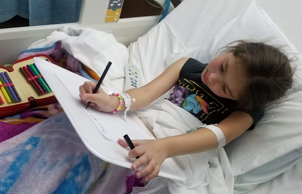 girl painting in the hospital