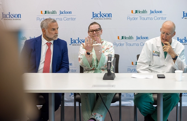 Doctors and injured woman in front of a press conference