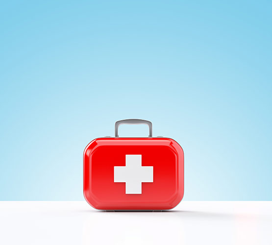 Red first aid kit on a blue background