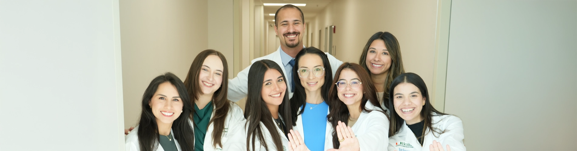 group of 1 male doctor and seven women