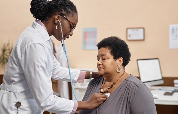 A doctor checking a women