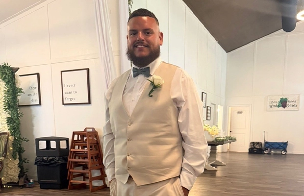 man dressed in beige at a wedding