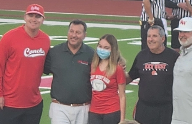 Photograph of people in a stadium