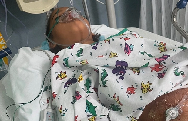 woman intubated in a hospital bed