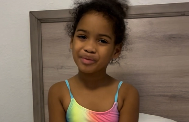 a girl posing and smiling at the camera