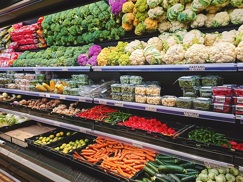 counter full of fruits and vegetables