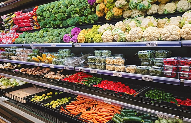 counter full of fruits and vegetables