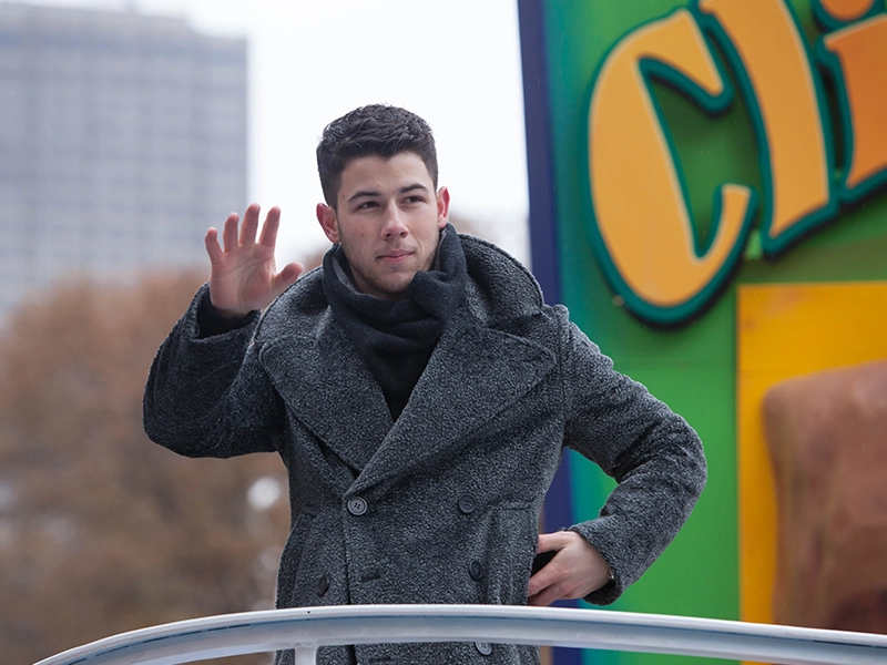 Photograph of one of the Jonas Brothers greeting his fans