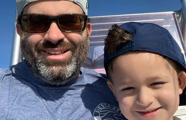 A selfie of a boy and his dad