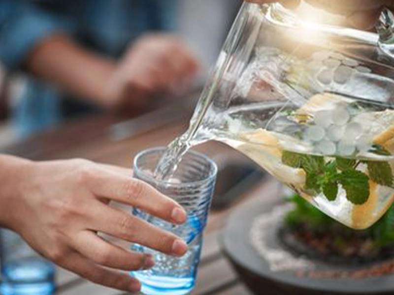 Close-up of a hand serving a drink
