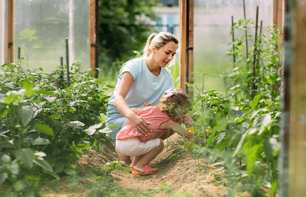 Girl and Mom Planting