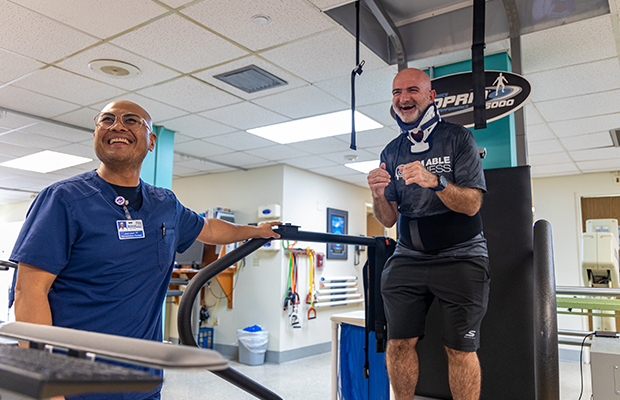 Ed Navarro receiving rehabilitation treatment by a Jackson Health System employee