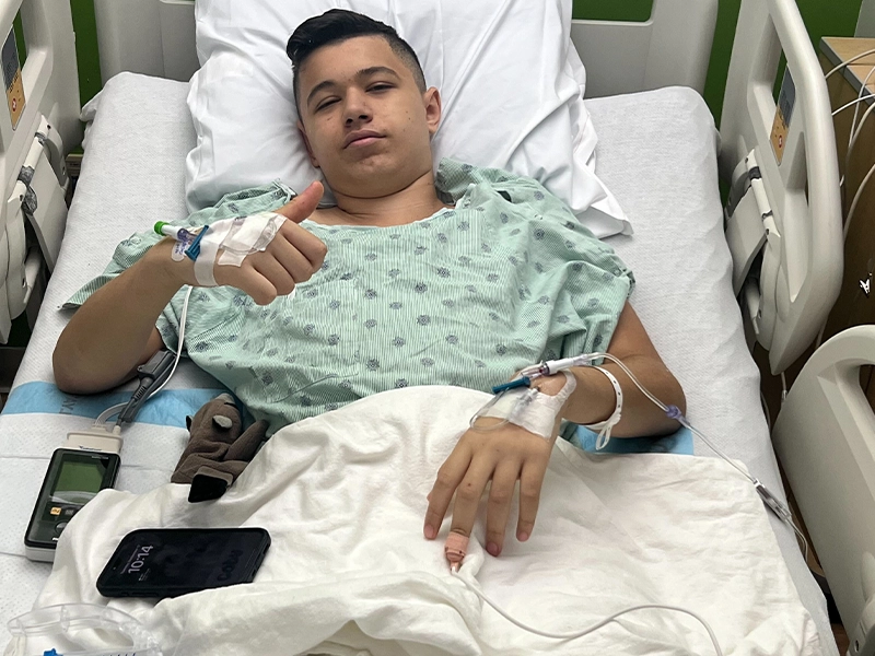Young teenager lying on hospital stretcher