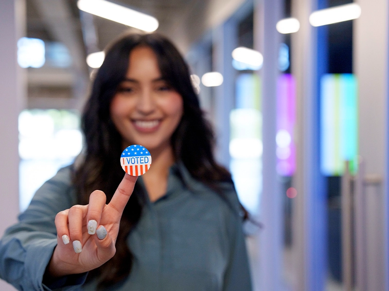 out of focus woman holding a sticker with the usa flag