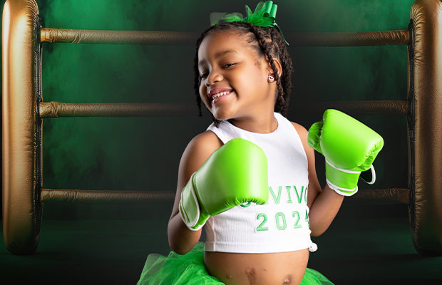 girl in boxing attire smiling