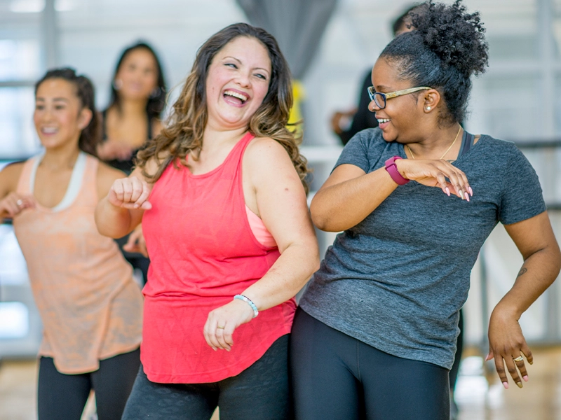 Two women doing zumba