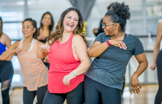 Two women doing zumba