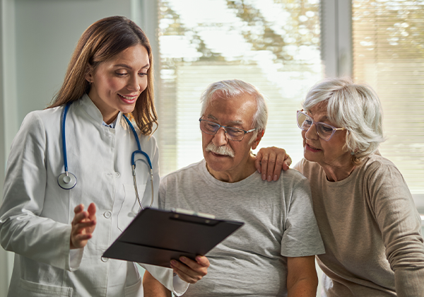 doctor attending consultation of elderly couple