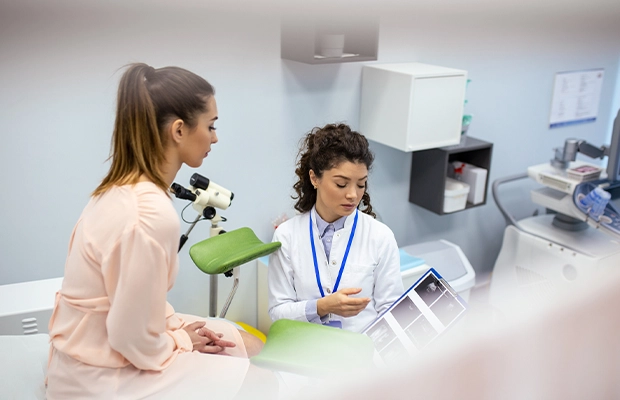 Doctor showing results to a patient in her office