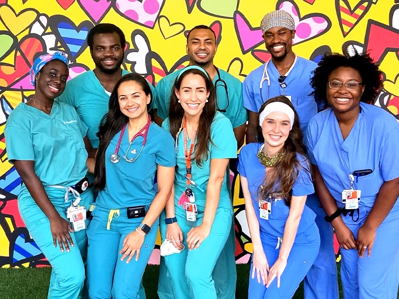group of people posing and smiling at the camera