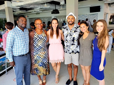 group of people posing and smiling at the camera